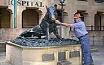 Larry the O with Sydney Hospital's "Big Pig" statue